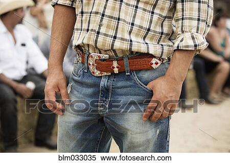 Stock Photography - Close up of Hispanic man standing outdoors. Fotosearch