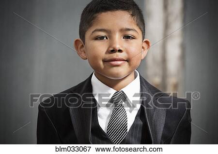 Stock Photo - Hispanic boy wearing formal suit. Fotosearch
