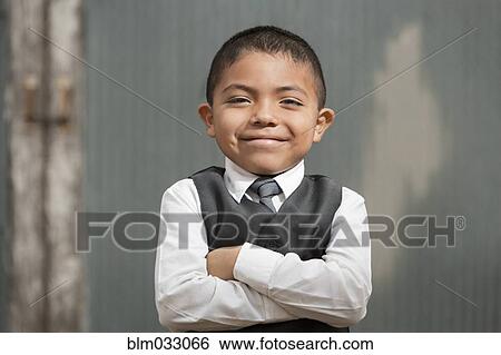 Stock Photograph - Hispanic boy wearing formal suit. Fotosearch
