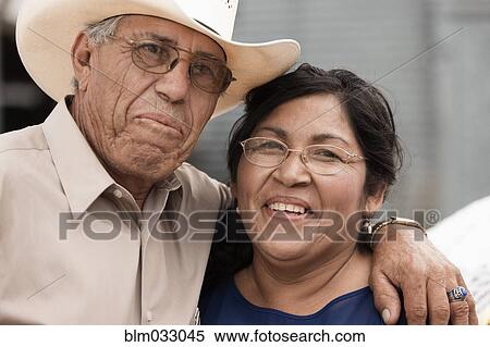 Stock Photography - Hispanic couple smiling outdoors. Fotosearch