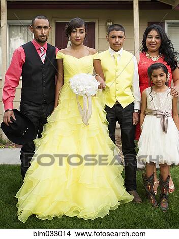 Picture - Hispanic family celebrating quinceanera. Fotosearch