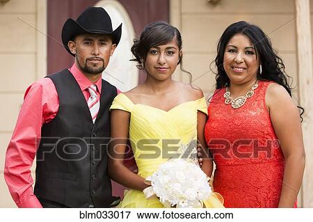 Stock Photo - Hispanic family celebrating quinceanera. Fotosearch