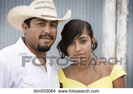 Picture - Hispanic father celebrating quinceanera of daughter. Fotosearch