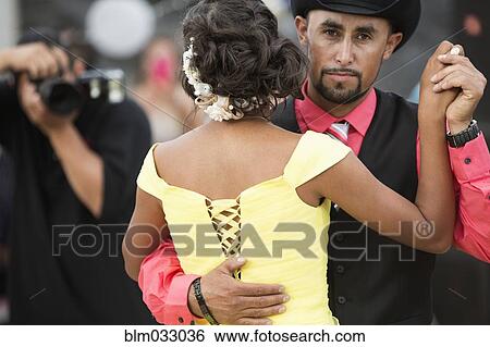 Stock Photograph - Hispanic father dancing with daughter at quinceanera. Fotosearch