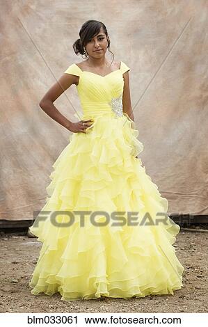 Stock Image - Hispanic girl wearing quinceanera dress. Fotosearch