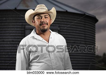 Hispanic man wearing cowboy hat View Large Photo Image Stock Image - Hispanic man wearing cowboy hat. Fotosearch