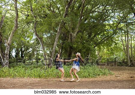 Pacific Islander women playing in forest View Large Photo Image Stock Photography - Pacific Islander women playing in forest. Fotosearch