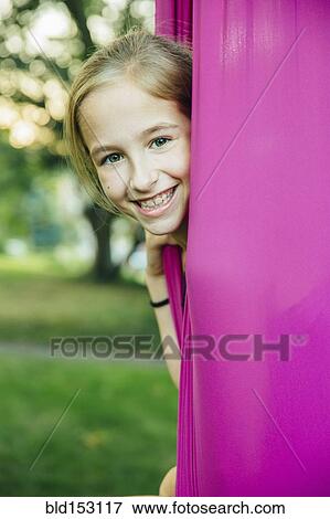 Acrobatic Caucasian girl sitting in hanging fabric View Large Photo Image Stock Photo - Acrobatic Caucasian girl sitting in hanging fabric. Fotosearch
