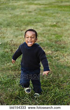 African American boy smiling in park View Large Photo Image Stock Image - African American boy smiling in park. Fotosearch