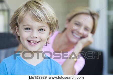 Caucasian boy smiling with mother View Large Photo Image Stock Photo - Caucasian boy smiling with mother. Fotosearch