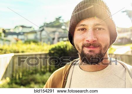 Caucasian man smiling in backyard View Large Photo Image Stock Image - Caucasian man smiling in backyard. Fotosearch