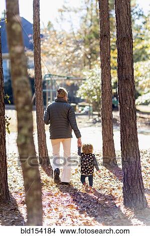 Caucasian mother walking with baby boy View Large Photo Image Picture - Caucasian mother walking with baby boy. Fotosearch