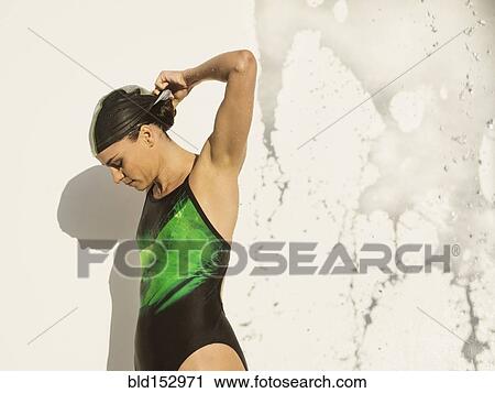 Caucasian swimmer standing near splashing water View Large Photo Image Stock Image - Caucasian swimmer standing near splashing water. Fotosearch