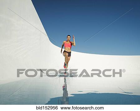 Caucasian woman running on water surface View Large Photo Image Stock Photograph - Caucasian woman running on water surface. Fotosearch