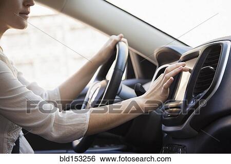 Caucasian woman using GPS system in car View Large Photo Image Stock Photograph - Caucasian woman using GPS system in car. Fotosearch