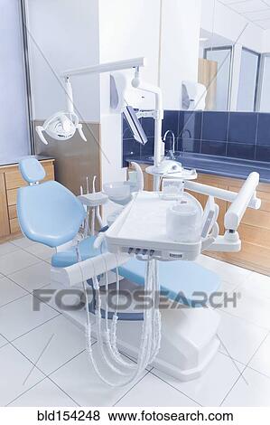 Stock Photo - Chair and medical equipment in office of dentist. Fotosearch