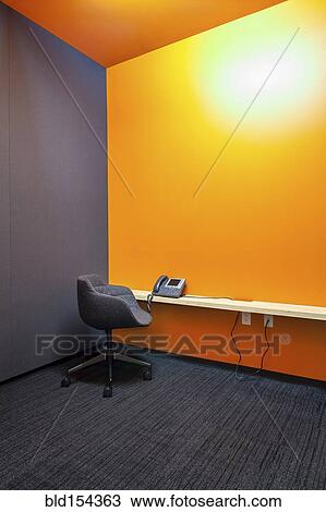 "Chair, desk and phone in empty office" View Large Photo Image Stock Image - "Chair, desk and phone in empty office". Fotosearch