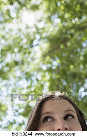 Close up of Caucasian woman looking up View Large Photo Image Picture - Close up of Caucasian woman looking up. Fotosearch