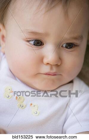 Stock Photography - Close up of confused mixed race baby. Fotosearch