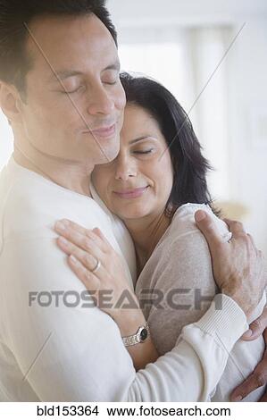Picture - Close up of couple hugging. Fotosearch