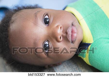 Close up of face of Black baby boy View Large Photo Image Stock Photo - Close up of face of Black baby boy. Fotosearch