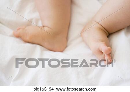 Picture - Close up of feet of mixed race baby. Fotosearch