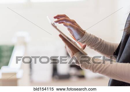 Close up of Hispanic businesswoman using digital tablet View Large Photo Image Stock Photography - Close up of Hispanic businesswoman using digital tablet. Fotosearch