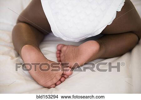 Picture - Close up of legs of Black baby boy. Fotosearch