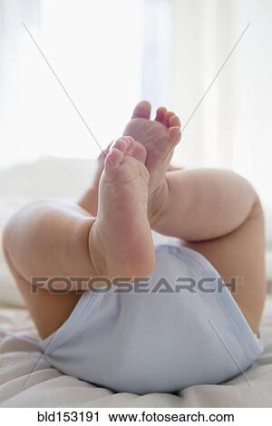 Close up of legs of mixed race baby View Large Photo Image Stock Image - Close up of legs of mixed race baby. Fotosearch