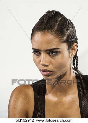 Close Up Of Mixed Race Woman With Braided Hair Stock Image