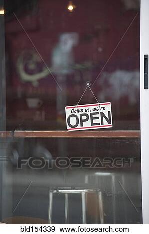 Stock Photo - Close up of open sign on cafe door. Fotosearch