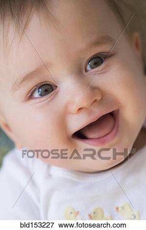 Stock Photo - Close up of smiling mixed race baby. Fotosearch