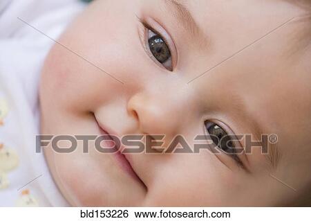 Stock Photograph - Close up of smiling mixed race baby. Fotosearch