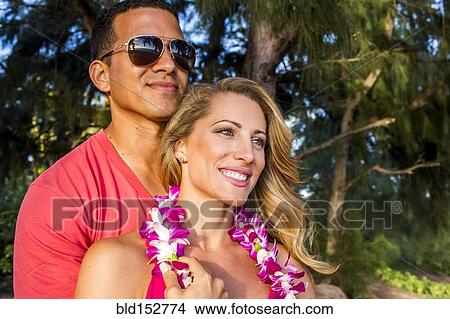 Couple hugging on tropical vacation View Large Photo Image Picture - Couple hugging on tropical vacation. Fotosearch