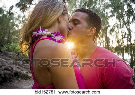 Couple kissing on beach View Large Photo Image Stock Image - Couple kissing on beach. Fotosearch