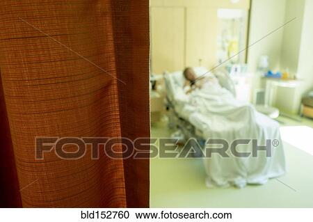 Defocused view of Caucasian woman laying in hospital bed View Large Photo Image Stock Image - Defocused view of Caucasian woman laying in hospital bed. Fotosearch