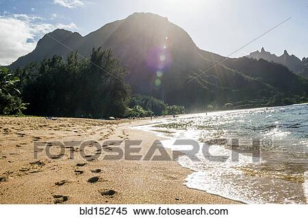 Footprints on sand near waves on tropical beach View Large Photo Image Stock Photography - Footprints on sand near waves on tropical beach. Fotosearch