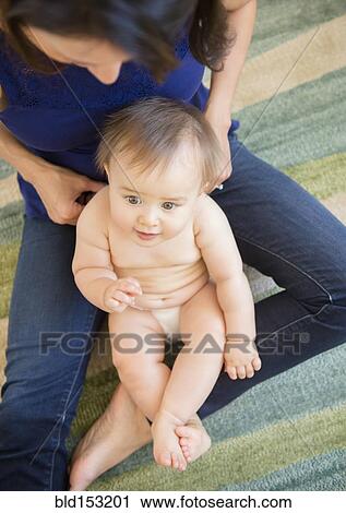 High angle view of mixed race mother playing with baby on floor View Large Photo Image Stock Image - High angle view of mixed race mother playing with baby on floor. Fotosearch