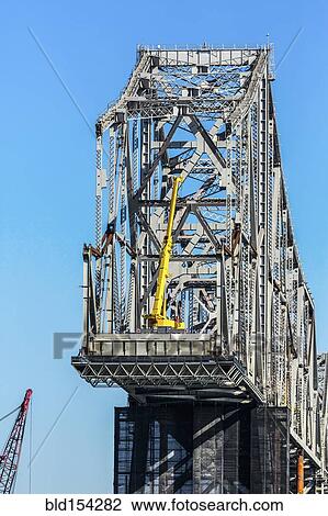 Low angle view of bridge under construction View Large Photo Image Stock Image - Low angle view of bridge under construction. Fotosearch