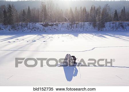 Mari man setting up tent in snowy field View Large Photo Image Stock Photography - Mari man setting up tent in snowy field. Fotosearch