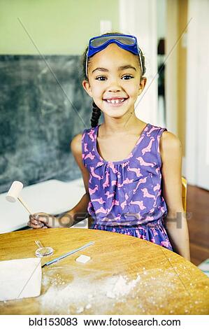 Mixed race girl doing science experiment at home View Large Photo Image Stock Image - Mixed race girl doing science experiment at home. Fotosearch