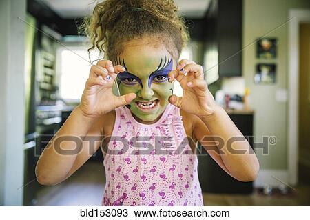 Mixed race girl growling with face paint View Large Photo Image Stock Image - Mixed race girl growling with face paint. Fotosearch