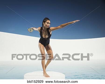 Mixed race woman on ice floe throwing discus View Large Photo Image Stock Photo - Mixed race woman on ice floe throwing discus. Fotosearch