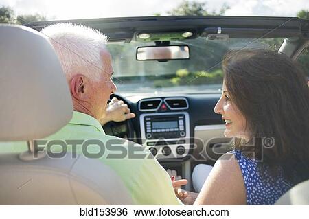 Older Caucasian couple driving in convertible View Large Photo Image Stock Photograph - Older Caucasian couple driving in convertible. Fotosearch