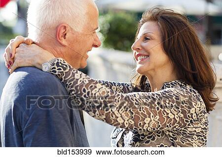 Older Caucasian couple hugging outdoors View Large Photo Image Stock Photo - Older Caucasian couple hugging outdoors. Fotosearch