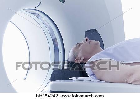 Older Hispanic man laying in MRI scanner View Large Photo Image Stock Image - Older Hispanic man laying in MRI scanner. Fotosearch