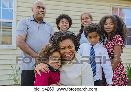 Pacific Islander family smiling outdoors View Large Photo Image Stock Photo - Pacific Islander family smiling outdoors. Fotosearch