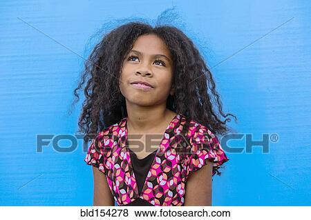 Stock Photo - Pacific Islander girl looking up. Fotosearch