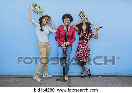 Pacific Islander girls holding musical instruments View Large Photo Image Stock Image - Pacific Islander girls holding musical instruments. Fotosearch