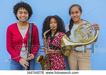 Pacific Islander girls holding musical instruments View Large Photo Image Stock Photograph - Pacific Islander girls holding musical instruments. Fotosearch